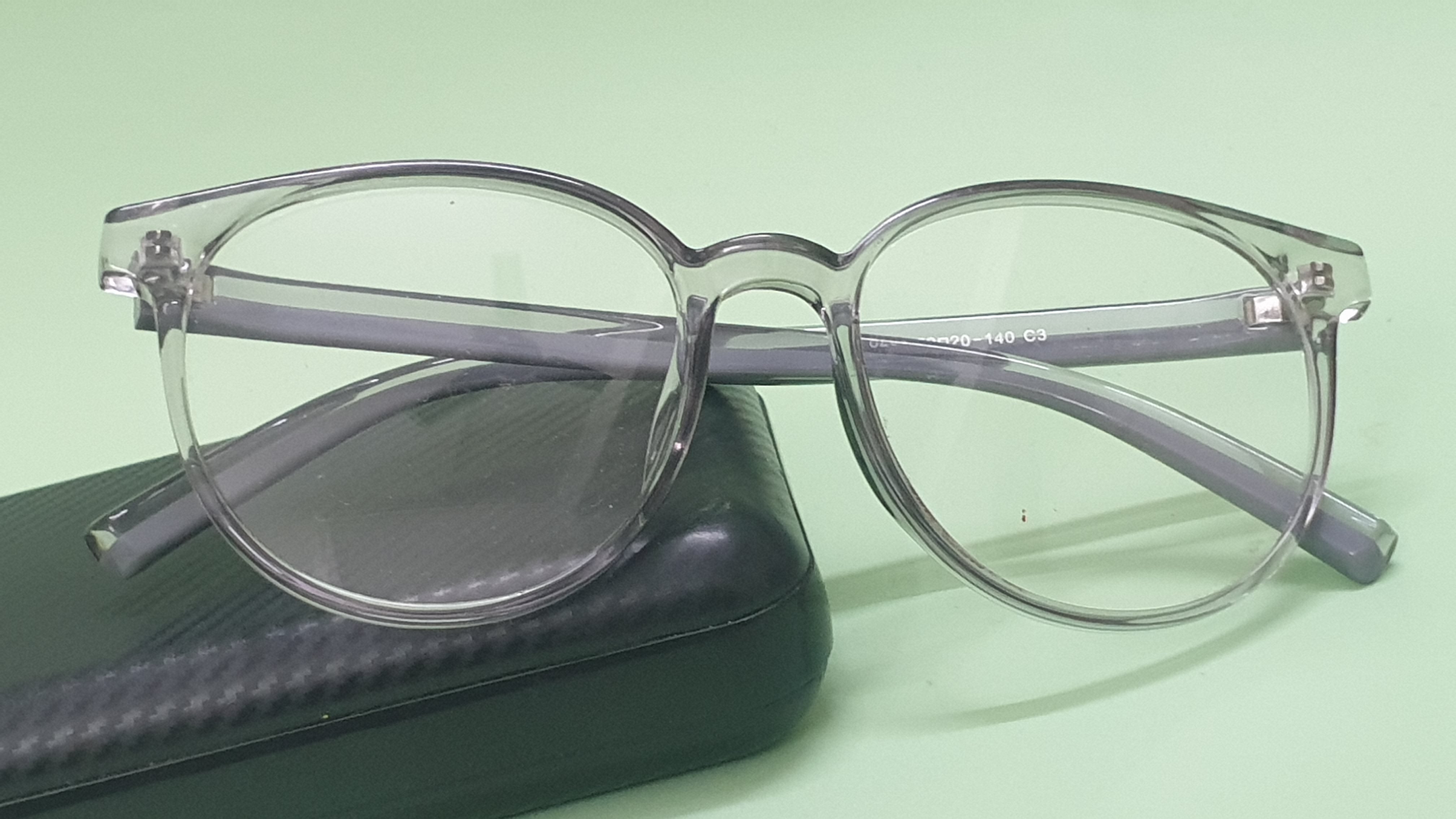 Grey transparent spectacle glasses